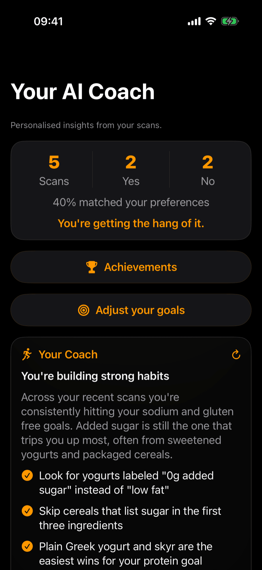 NutriGoalCheck's AI Coach screen, showing scan stats and personalized tips such as choosing yogurts labeled zero grams added sugar.